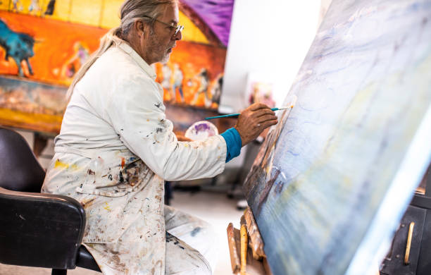 istock Artist painting in his studio 1157326335