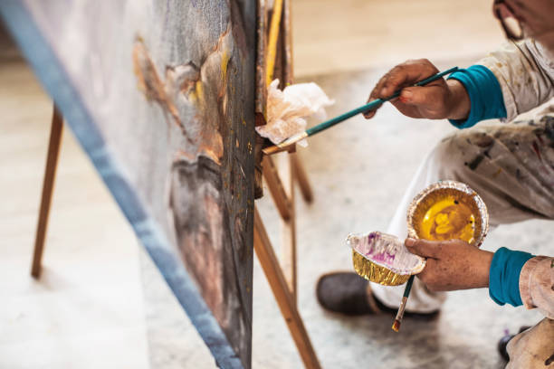 istock Artist painting in his studio 1157326396