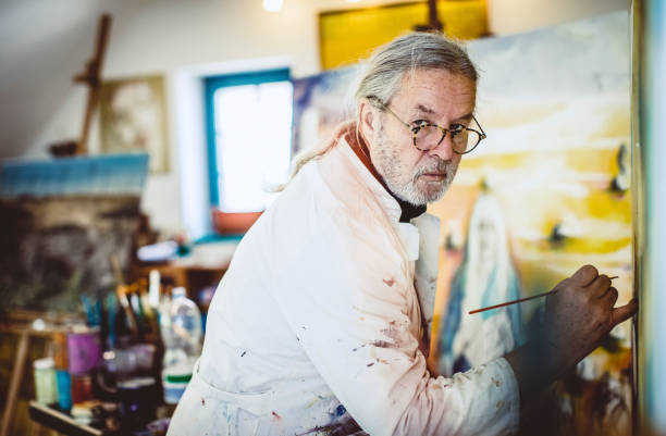istock Artist painting in his studio 1157327499