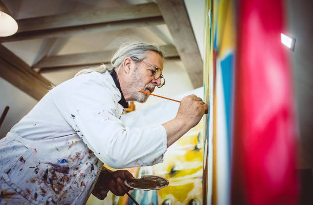 istock Artist painting in his studio 1157327503