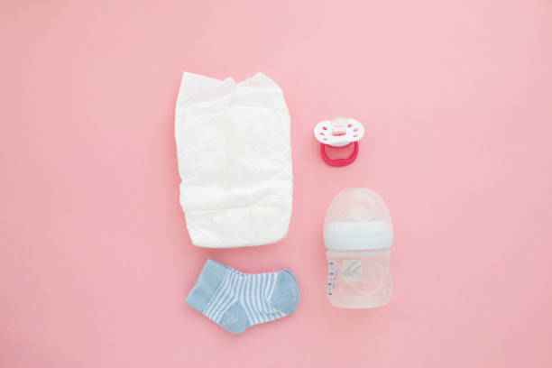 istock Set for a newborn nipple bottle diaper socks 1157327517