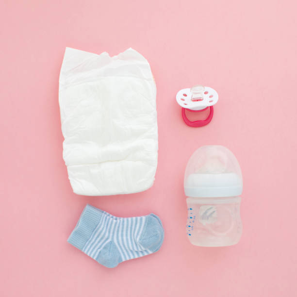 istock Set for a newborn nipple bottle diaper socks 1157327534