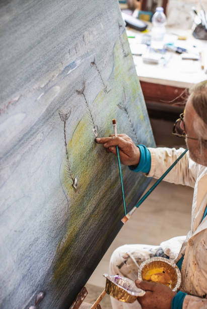 istock Artist painting in his studio 1157327560