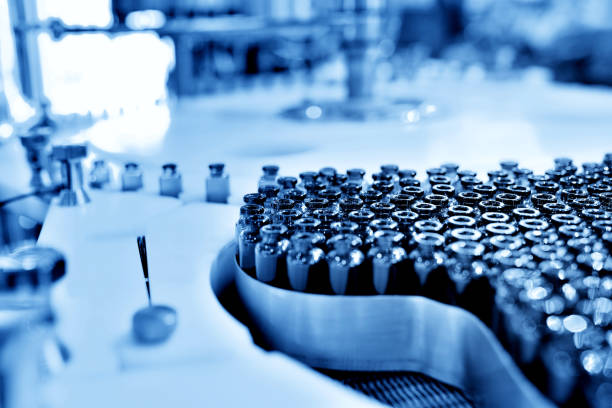 istock Glass Bottle Filling at Production Line Workbench 1157329318