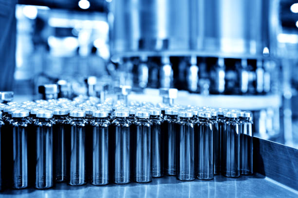 istock Glass Bottle Filling at Production Line Workbench 1157329331