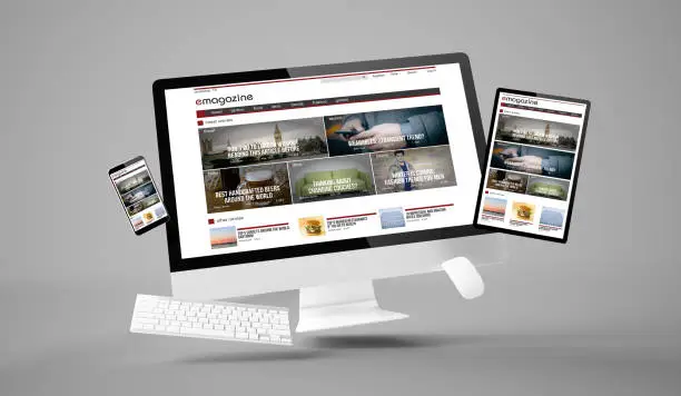 Photo of computer, tablet and smartphone gravity showing e-magazine responsive website