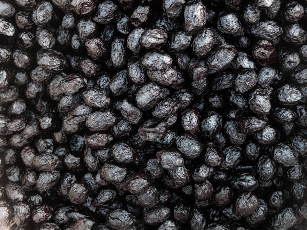 istock Black pickled olives. Texture or background concept 1157329729