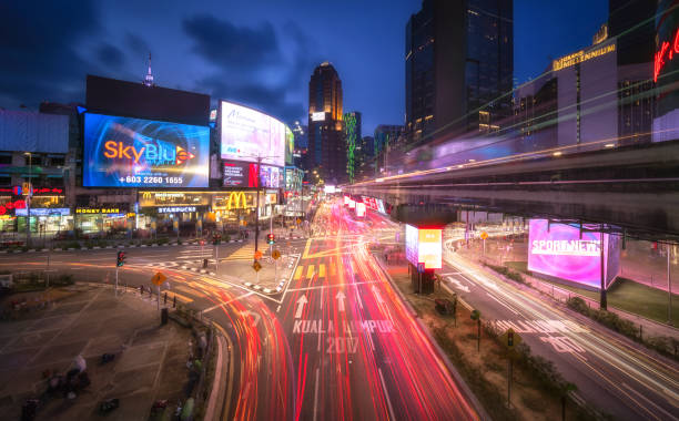 kuala lumpur street light trail - lumpur stock-fotos und bilder