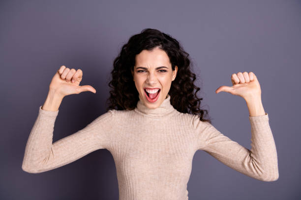 istock Close up photo beautiful ecstatic she her overjoyed lady girlish say yeah indicating directing fingers herself crazy funny funky toothy wear casual pastel sweater pullover isolated grey background 1157340146