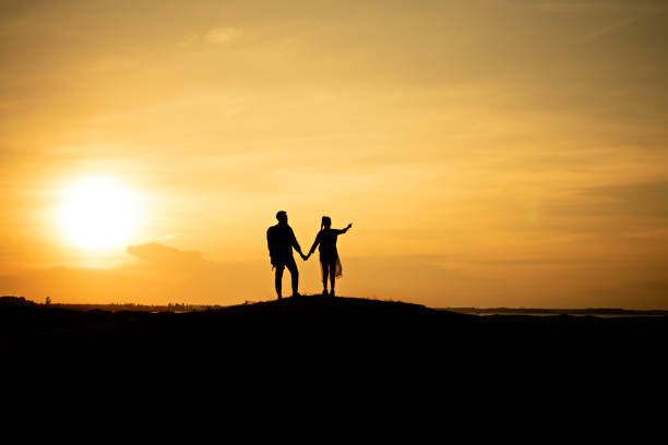 istock Silhouette traveler couples walking 1157340626