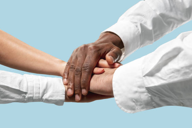 istock Male and female hands holding isolated on blue studio background 1157341908