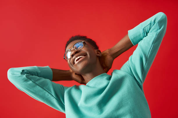 istock Happy man in glasses is making dance moves in studio 1157343691