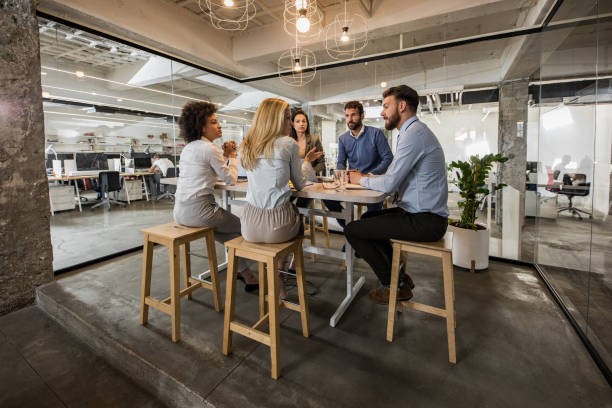 istock Young business team talking on a meeting in the office. 1157343845