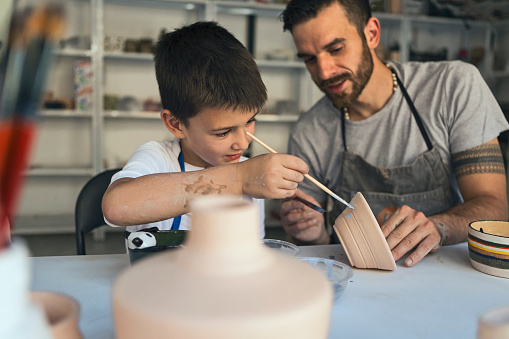 Artistic family working with clay
