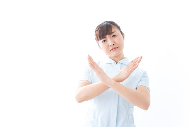 Young nurse showing a NO sign
