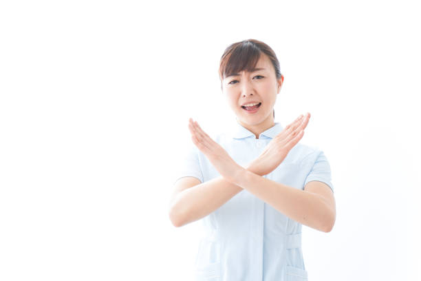 istock Young nurse showing a NO sign 1157350717