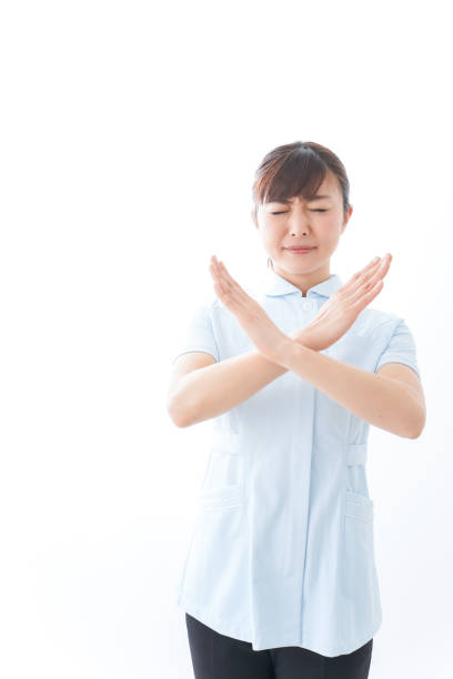 istock Young nurse showing a NO sign 1157350723