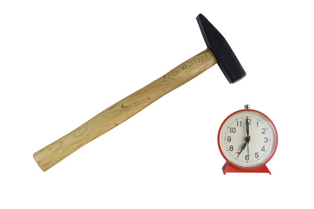 istock Hammer Hitting Alarm clock , isolated on white 1157352391