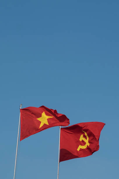 istock Vietnamese and communist flags in the wind 1157352694