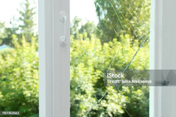 Broken Glass On A Wooden Window Frame Stock Photo - Download Image Now - Window, Broken, Cracked