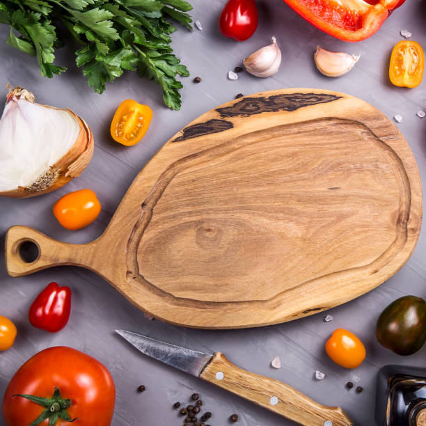 istock Ripe tomatoes for cooking vegetable dish on a gray background 1157353581