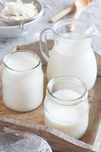 istock Fermented drink kefir in small bottles and kefir grains 1157353829
