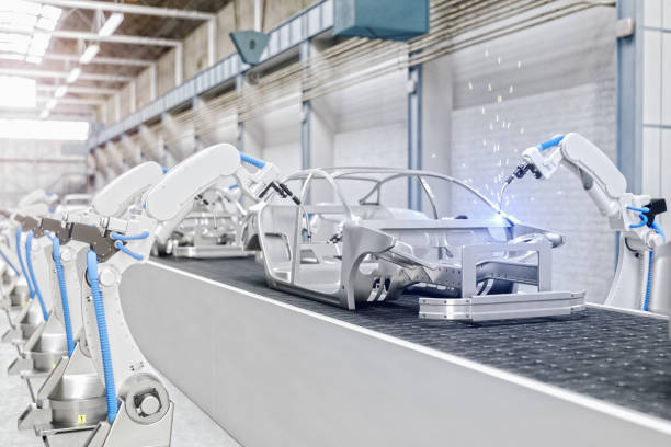 robots industriales en la línea de montaje de la fábrica de fabricación automática de automóviles - fábrica de coches fotografías e imágenes de stock