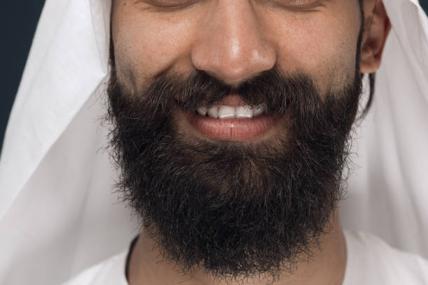 istock Arabian saudi man on dark blue studio background 1157355354