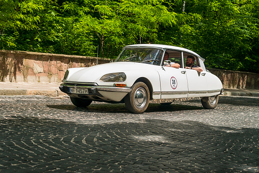 Lviv, Ukraine - June 2, 2019: Old retro car Citroen DS (1970) with its owner and  unknown passenger taking participation in race Leopolis grand prix 2019, Ukraine.