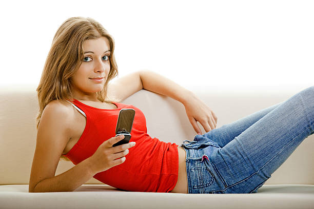 istock Young woman with a cell phone 115735910