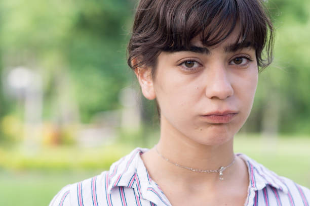 istock Young woman making different facial expressions 1157362119
