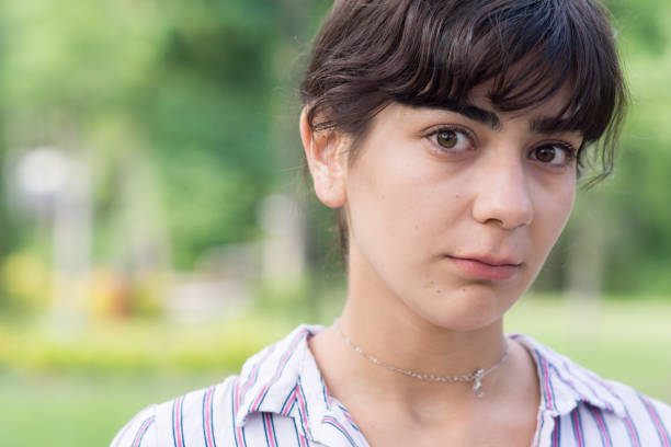 Young woman making different facial expressions stock photo