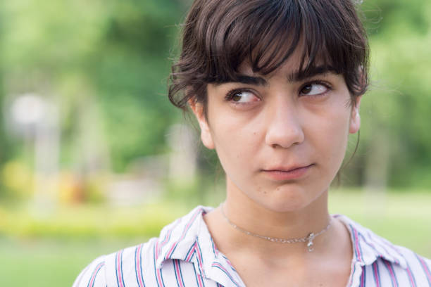 istock Young woman making different facial expressions 1157362153