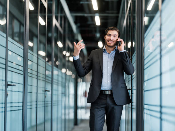 istock Young businessman chatting on a cellphone 1157362225
