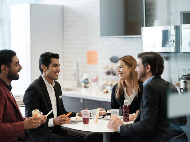 istock Office team eating lunch in the break room 1157362249