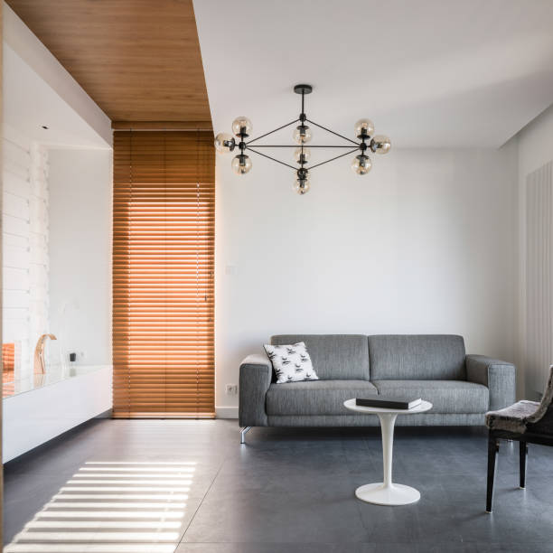 istock Living room with wooden blinds 1157362731
