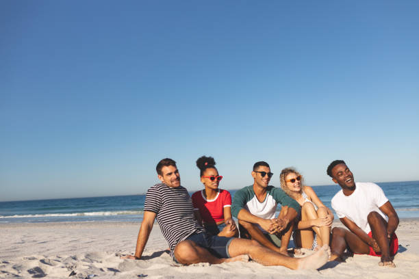 istock Group of friends having fun together on the beach 1157364475