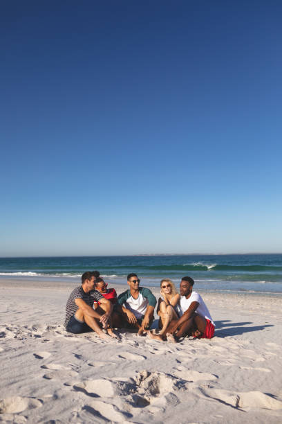 istock Group of friends having fun together on the beach 1157364616