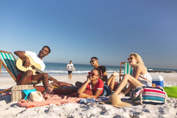 istock Group of friends having fun together on the beach 1157368227