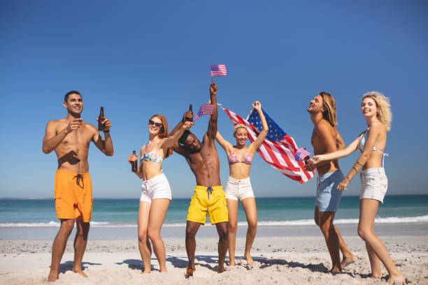istock Group of friends having fun together on the beach 1157376405
