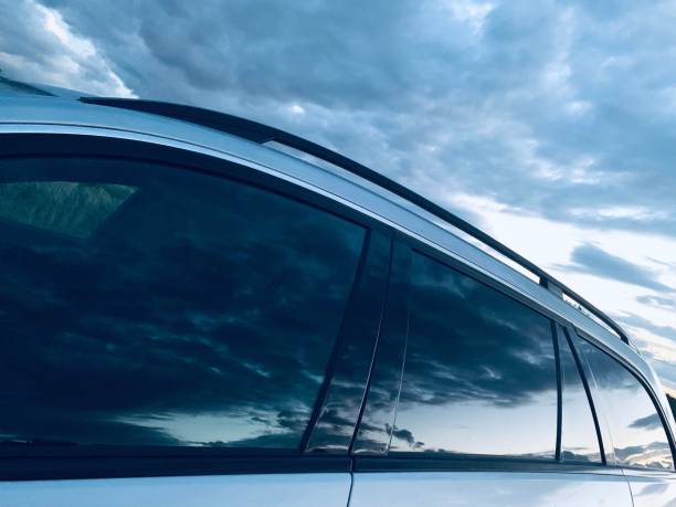 Dramatic sky reflecting in car windows stock photo