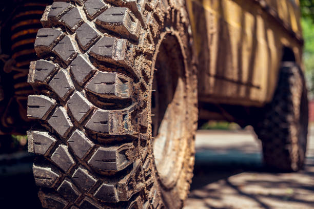 Close-up shot of dirty big off-road tires stock photo