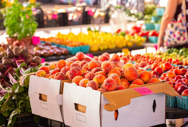 istock Fresh Yellow Peaches at a Community Market 1157378053