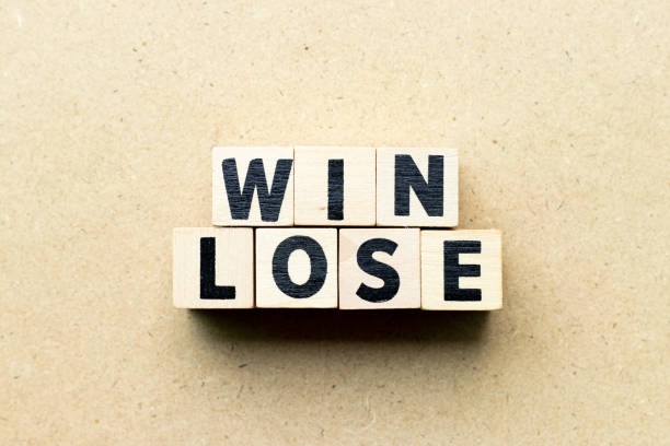 istock Letter block in word win lose on wood background (Concept of game theory) 1157378063