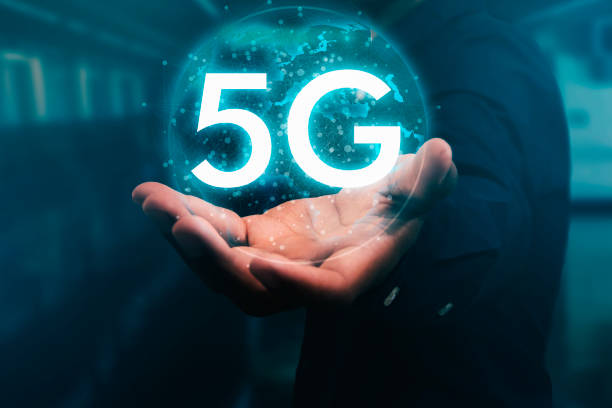 istock Businessman holding the world with 5G graphics and technology connections are developing to be the most advanced technology in the world. 1157378112