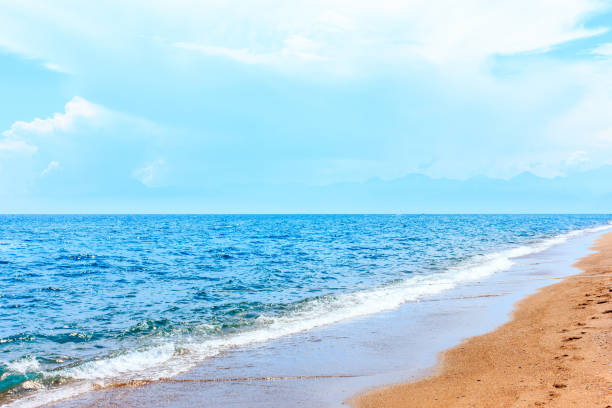 istock Calm blue mediterranean sea and yellow sand 1157380688