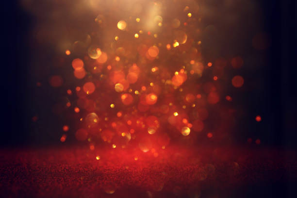 istock abstract Red glitter lights background. defocused. 1157381935
