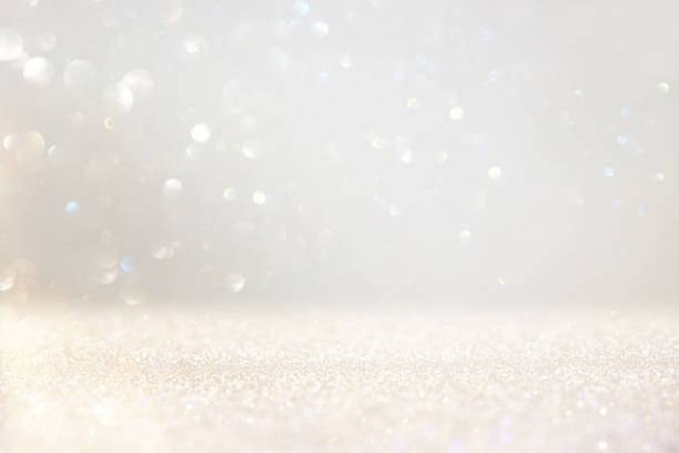 istock glitter vintage lights background. silver and white. de-focused 1157382093