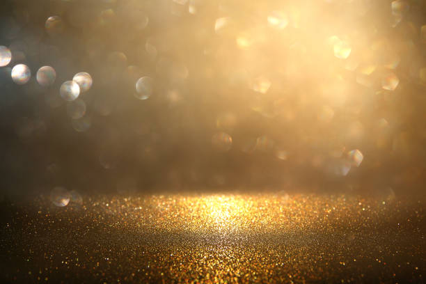 istock glitter vintage lights background. gold and black. de-focused. 1157382814