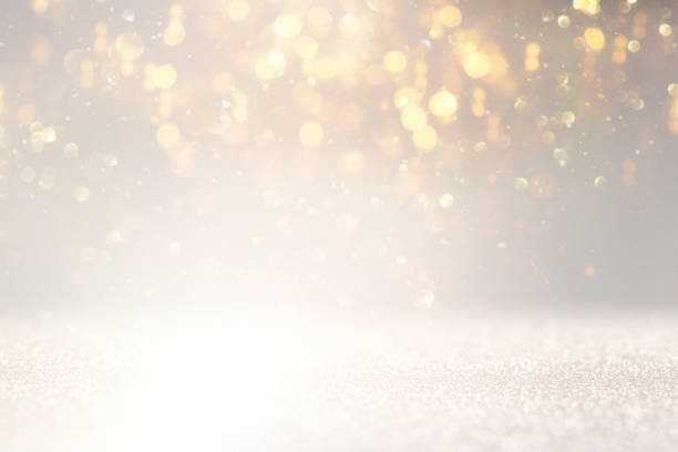 istock glitter vintage lights background. silver and white. de-focused 1157382818